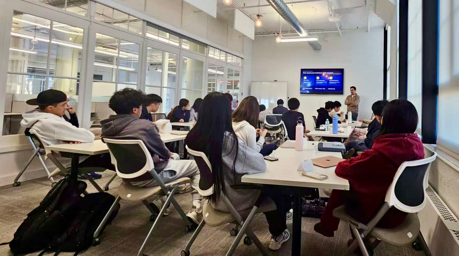 Students learning with a speaker in a real YELIC classroom