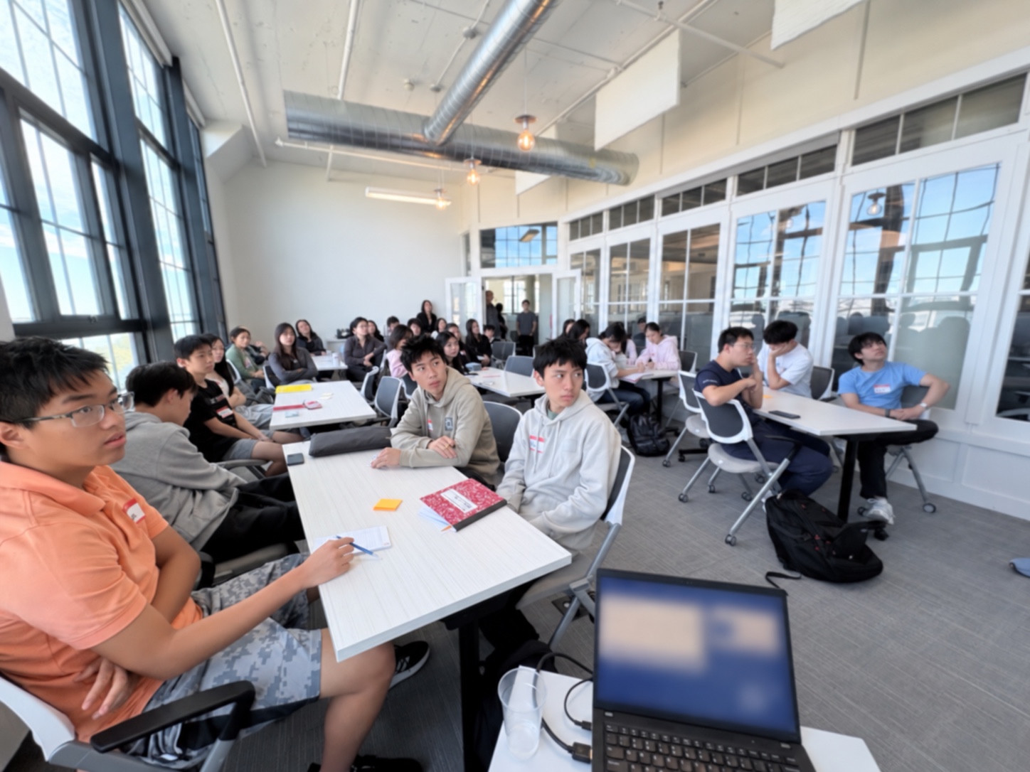 Students learning together in a bright YELIC Mini-MBA classroom
